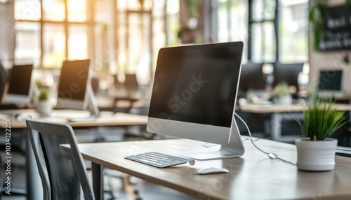 Computer Screen on a Wooden Desk in an Office with Beautiful Light from the Window