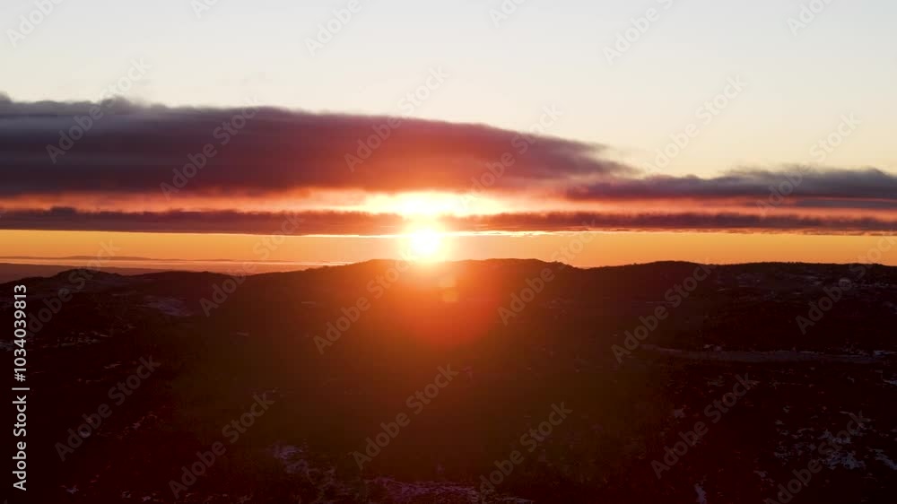 Sunrise Flares and Clouds in the Sunrise of the Snowy Mountains of Australia Sunrise Flares and Clouds in the Sunrise of the Snowy Mountains of Australia