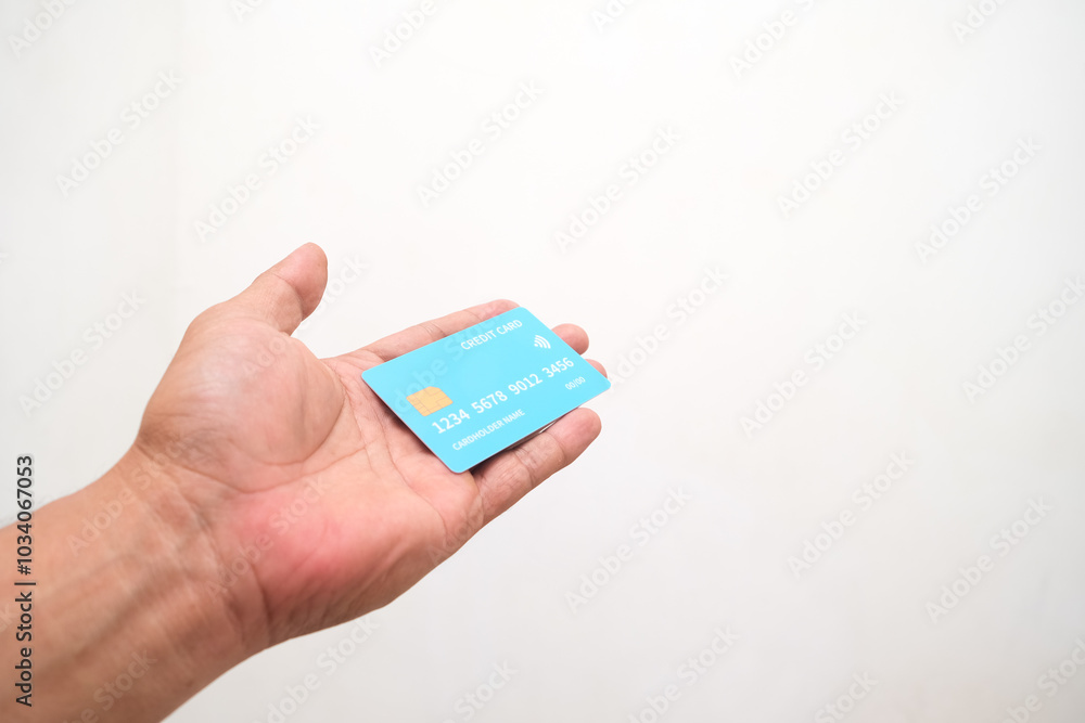 Hand showing credit card, or card, or business card or voucher, isolated on white background, template, mock-up Hand showing credit card, or card, or business card or voucher, isolated on white background, template, mock-up