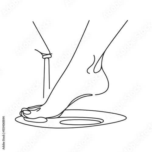 A woman's foot is shown in a close up. The foot is on a plate and the plate is on a table. The image is in black and white