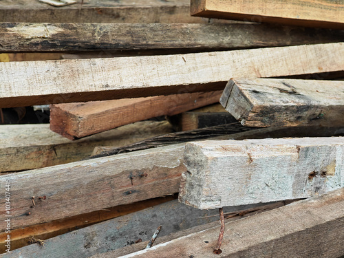 Pile of pieces of scrap wood blocks with nails