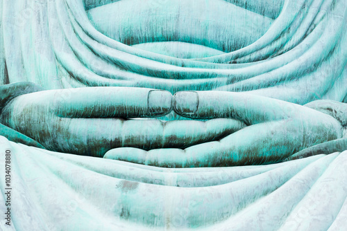 Closeup hand of the great blue buddha statue Daibutsu at Doiprazan temple in Lampang province, Thailand..