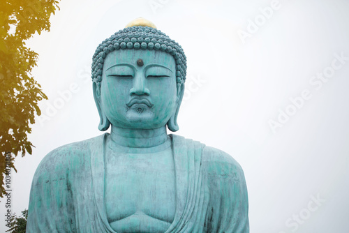 The great blue buddha statue Daibutsu at Doiprazan temple in Lampang province, Thailand..