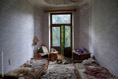 Room in an abandoned hotel destroyed by time photo