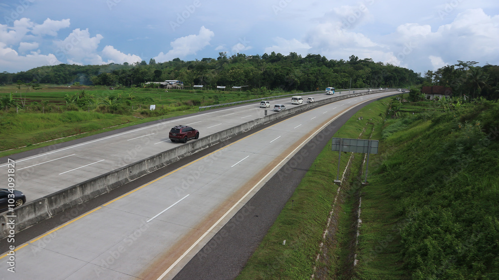 Salatiga, 13 Nov 2022 - Car and bus traffic on the Salatiga - Solo toll road. Salatiga, 13 Nov 2022 - Car and bus traffic on the Salatiga - Solo toll road.