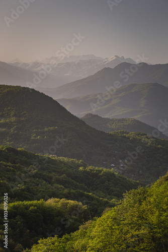 mountain ranges at sunset in the haze