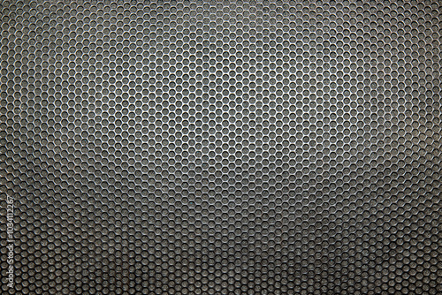 Bilde på lerret Photo of a real metal speaker grill showing the black grill and padding undernea
