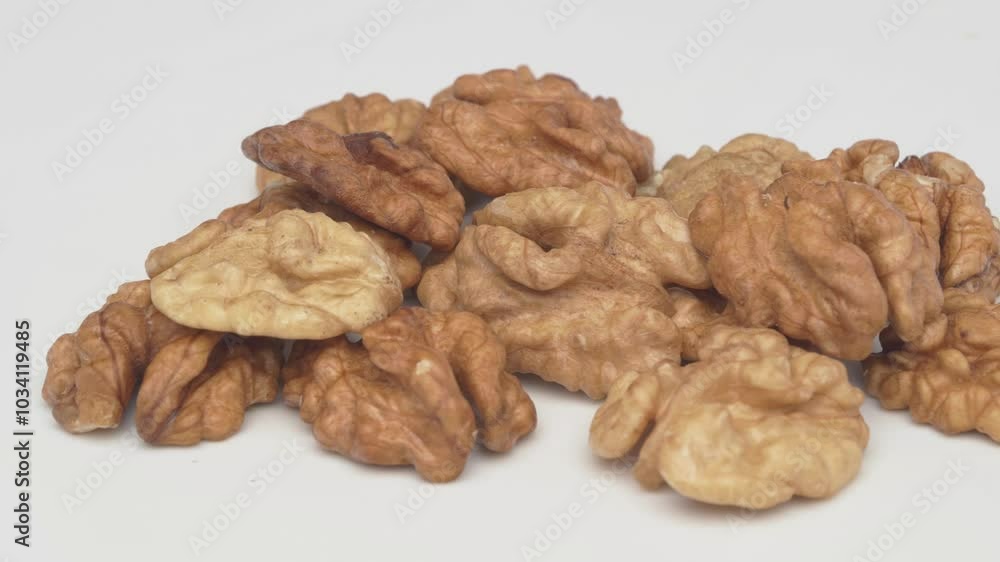 Natural Walnuts Beautifully Displayed on a Clean White Background, Creating a Fresh Visual Appeal Natural Walnuts Beautifully Displayed on a Clean White Background, Creating a Fresh Visual Appeal