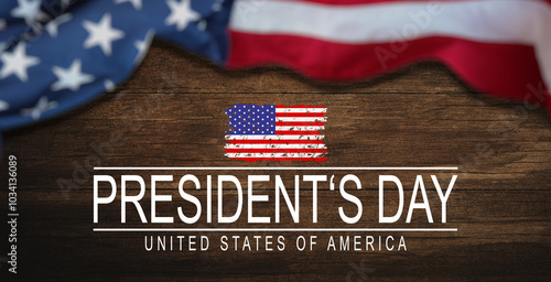 United States National Holidays. American or USA Flag with "HAPPY PRESIDENT'S DAY" text on wooden ement background, President Day concept