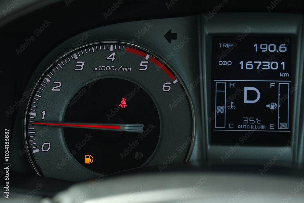 Empty fuel warning light in car dashboard. Fuel pump icon. gasoline gauge dash board in car with digital warning sign of run out of fuel turn on. Low level of fuel show on speedometer dashboard. Empty fuel warning light in car dashboard. Fuel pump icon. gasoline gauge dash board in car with digital warning sign of run out of fuel turn on. Low level of fuel show on speedometer dashboard.
