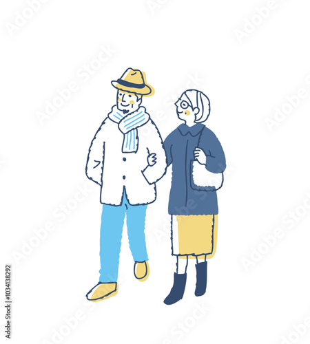 腕を組んで歩いている冬服のシニアカップル