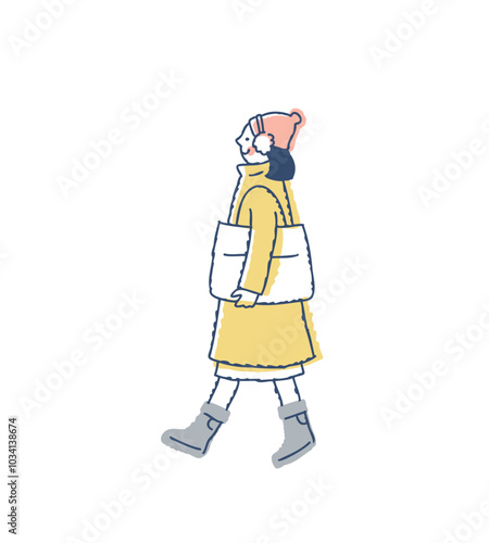 歩いている冬服の若い女性