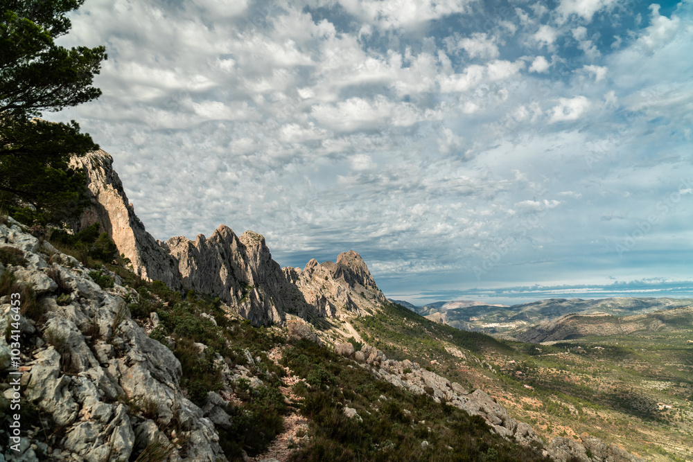 Panoramic view of a rocky mountain with some peaks, in Bernia, Alicante (Spain) Panoramic view of a rocky mountain with some peaks, in Bernia, Alicante (Spain)