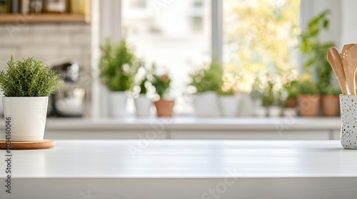 Clean, empty white countertop with blurred kitchen background, ideal for showcasing products or creating a minimalist kitchen mockup