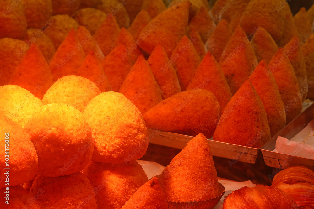rice balls made with ragu and cheese, also known as arancini or arancine a traditional dish from southern Italy's island of Sicily rice balls made with ragu and cheese, also known as arancini or arancine a traditional dish from southern Italy's island of Sicily