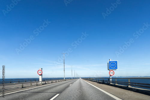 Billede på lærred Highway road to Denmark with a sign about crossing the border of Denmark