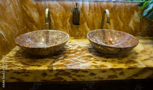 a fashionable sink in the toilet room. Modern interior in the toilet photo