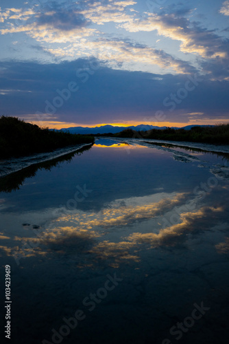 Riflesso del cielo durante un alba in una laguna photo