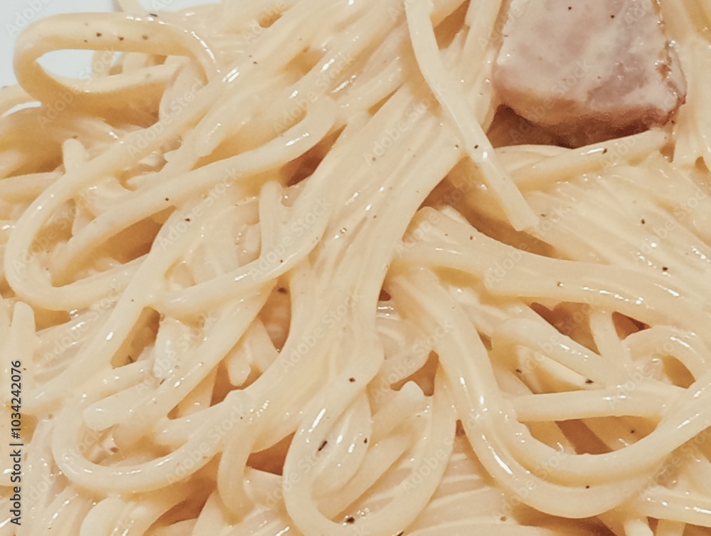spaghetti pasta with carbonara sauce, egg and bacon. typical dish of Roman cuisine. Italian food