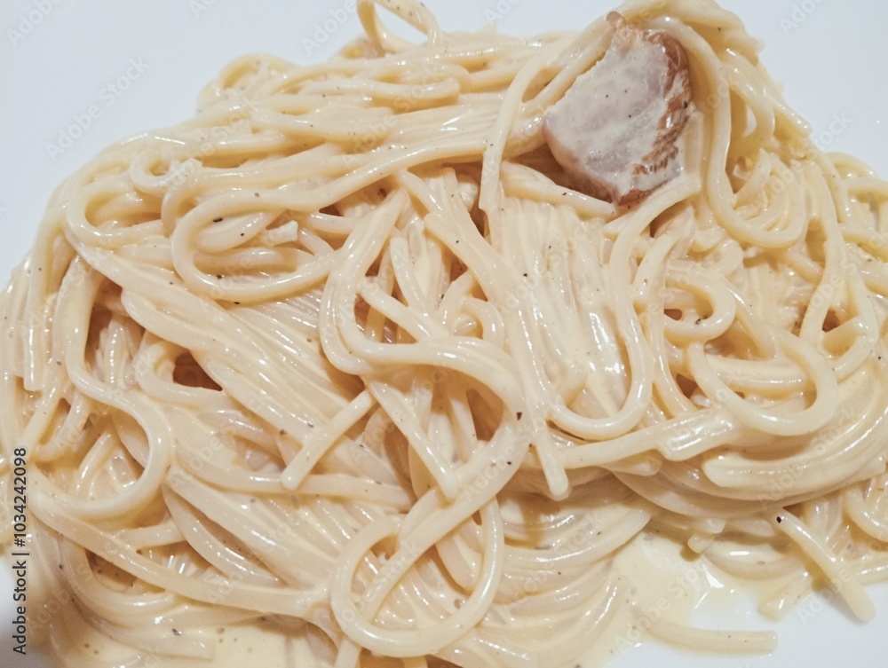 spaghetti pasta with carbonara sauce, egg and bacon. typical dish of Roman cuisine. Italian food
