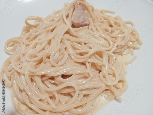 spaghetti pasta with carbonara sauce, egg and bacon. typical dish of Roman cuisine. Italian food