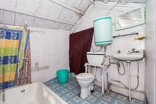 SRINAGAR, INDIAN KASHMIR: interior of basic bedroom, made of wood, inside a houseboat, on Dal Lake photo