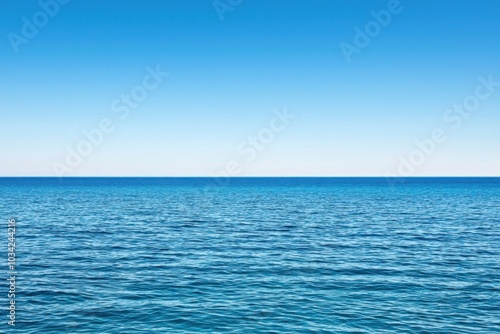 Serene ocean view with clear blue water and sky, perfect for relaxation and tranquility.