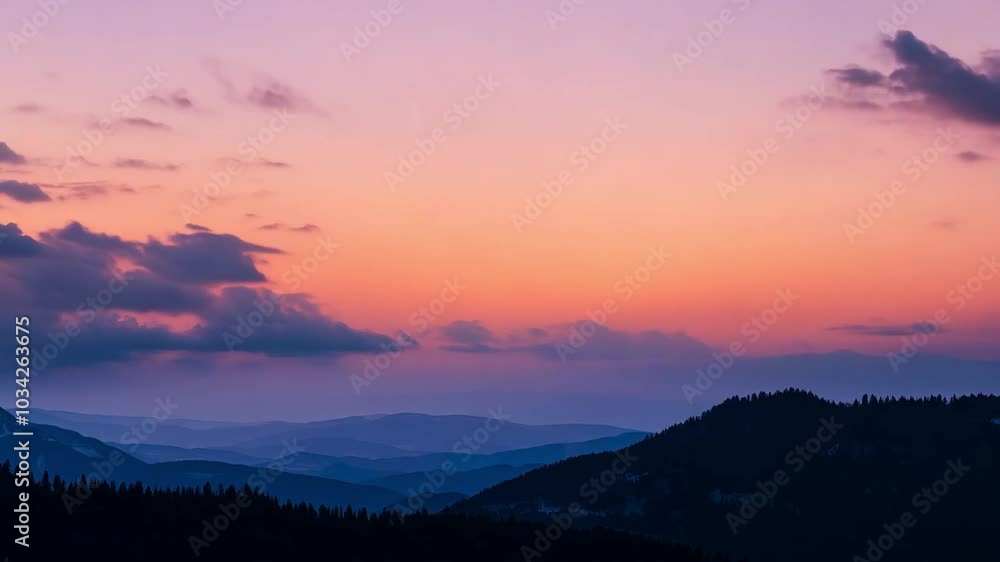 Clouds drift across a vibrant mountain sunset, painting the sky with shades of orange, pink, and purple in a tranquil scene Clouds drift across a vibrant mountain sunset, painting the sky with shades of orange, pink, and purple in a tranquil scene