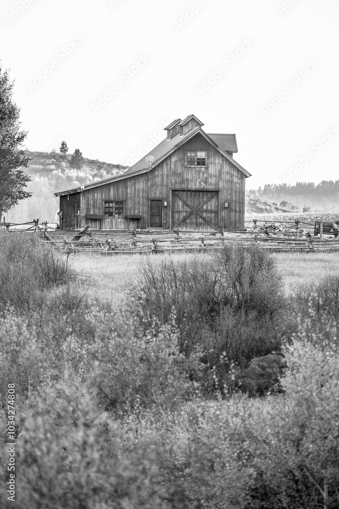 Old Barn in the mountains at sunset in Wyoming