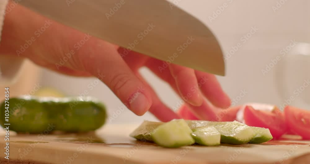 A skilled hand meticulously slicing fresh, colorful vegetables in a warm, cozy kitchen setting for a nutritious meal A skilled hand meticulously slicing fresh, colorful vegetables in a warm, cozy kitchen setting for a nutritious meal