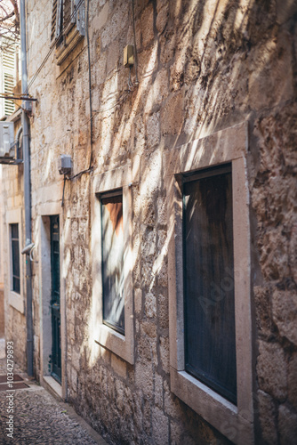 old stone house with closed shutters in backstreet of Old Town, Dubrovnik, Croatia