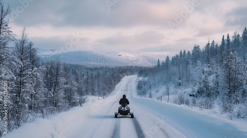 Winter Finnish snowy lanscape with road and snowmobile. 