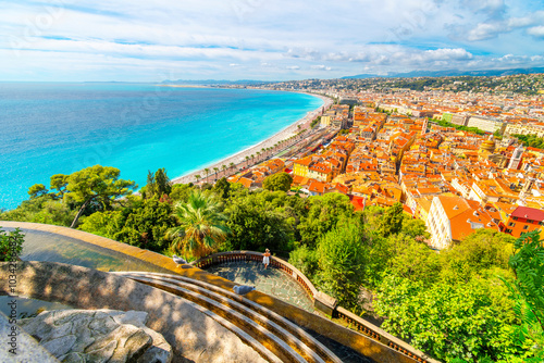 View from atop the Colline du Château manmade waterfall on Castle Hill overlooking the Bay of Angels turquoise sea, Vieux Ville Old Town and Promenade des Anglais, Nice France, French Riviera.