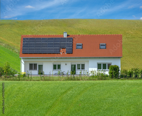Obraz na płótnie House with photovoltaic on the roof (Building and surroundings modified by image editing) w salonie