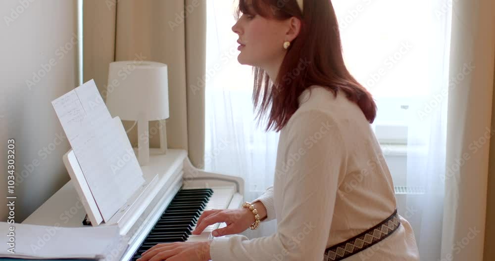 A woman finds joy in playing the piano, deeply focusing on her sheet music within a beautifully sunlit, elegant room A woman finds joy in playing the piano, deeply focusing on her sheet music within a beautifully sunlit, elegant room