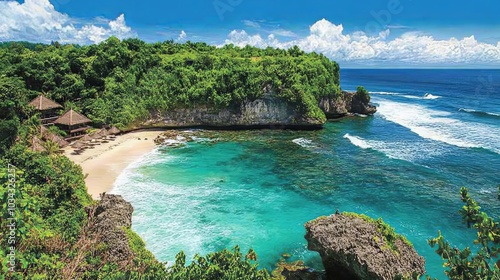 An aerial view of Diamond Beach, Bali, showcasing vibrant turquoise waters crashing against the rugged cliffs, with a lush green outcrop jutting into the ocean and a small pristine beach nestled betwe photo