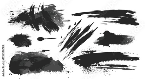 Dynamic assortment of black ink brush strokes and splatters on a white background, showcasing artistic expression and abstract design.
