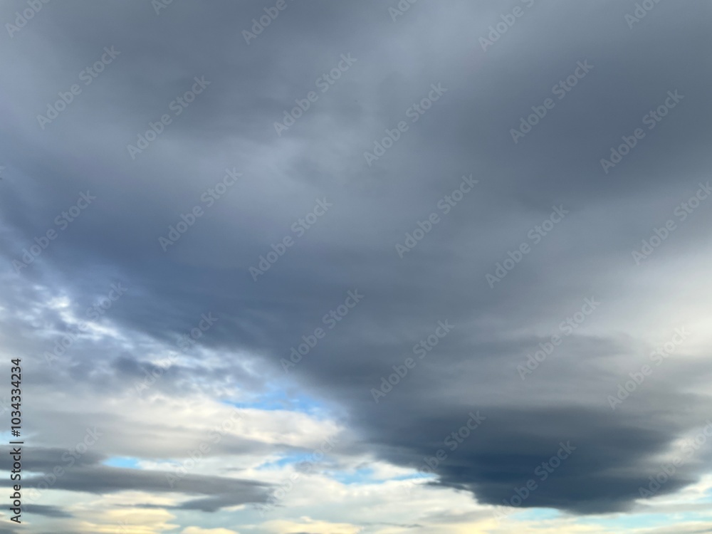 Cloudy sky with Lenticular clouds on windy weather - natural background. Topics: wind, meteorology, atmosphere, air space, season Cloudy sky with Lenticular clouds on windy weather - natural background. Topics: wind, meteorology, atmosphere, air space, season