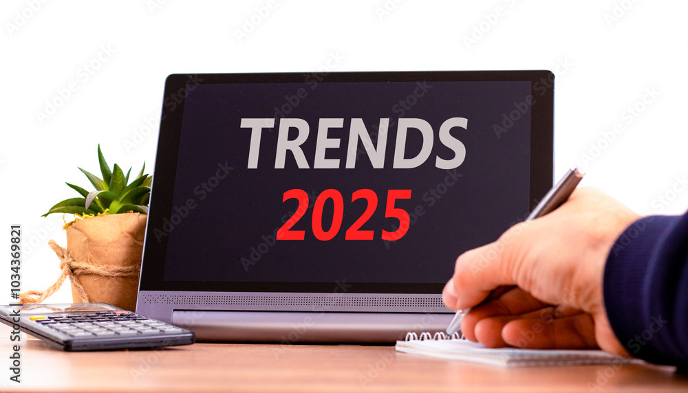 Planning trends 2025 new year symbol. Concept words Trends 2025 on beautiful black tablet. Beautiful white background. Businessman hand. Business trends 2025 new year concept. Copy space. Planning trends 2025 new year symbol. Concept words Trends 2025 on beautiful black tablet. Beautiful white background. Businessman hand. Business trends 2025 new year concept. Copy space.