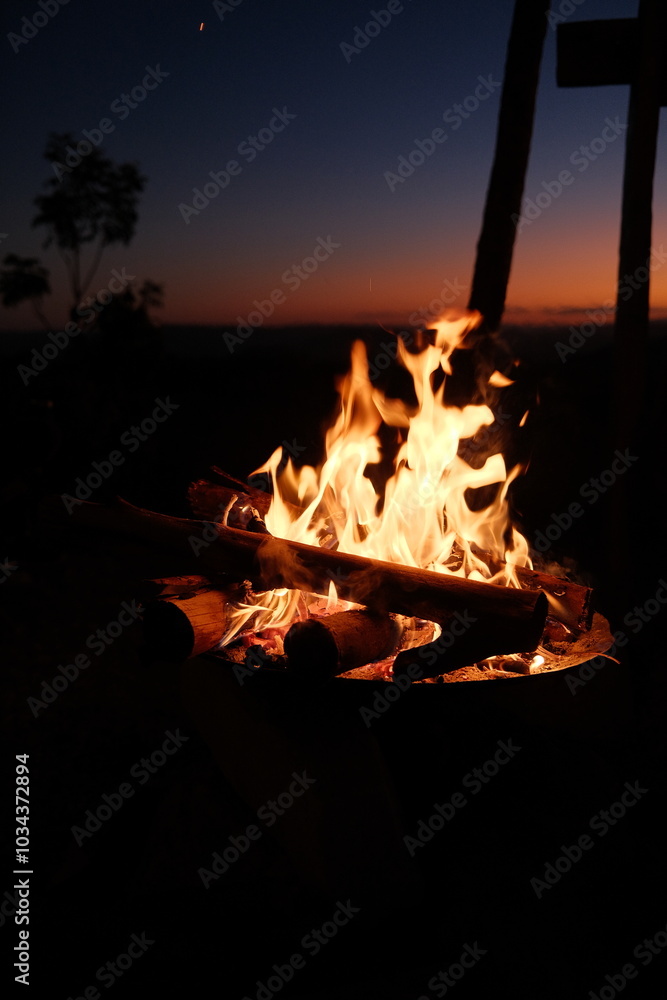 custom made wallpaper toronto digitalA glowing bonfire crackles in the foreground with a stunning sunset and silhouettes of trees in Chapada dos Veadeiros, Brazil, creating a peaceful, nature-filled evening setting.
