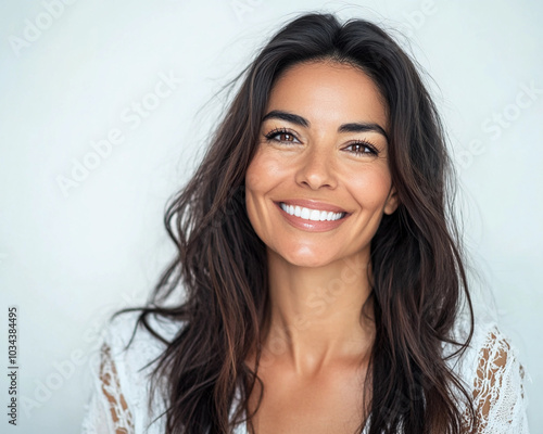 beautiful latina model woman in her 40s with long hair portrait for skincare hair care or headshot 