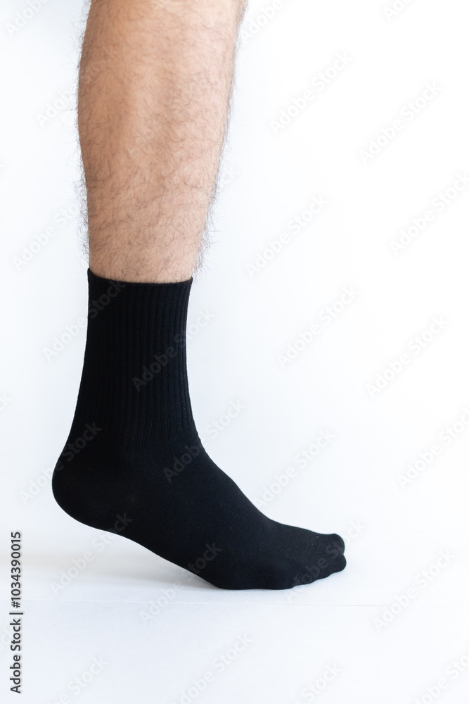 Male legs in socks. Isolated on white background. Male legs in socks. Isolated on white background.