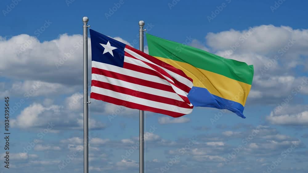 Gabon and Liberia flags flying together, video concept of the relationship, two country relations concept Gabon and Liberia flags flying together, video concept of the relationship, two country relations concept