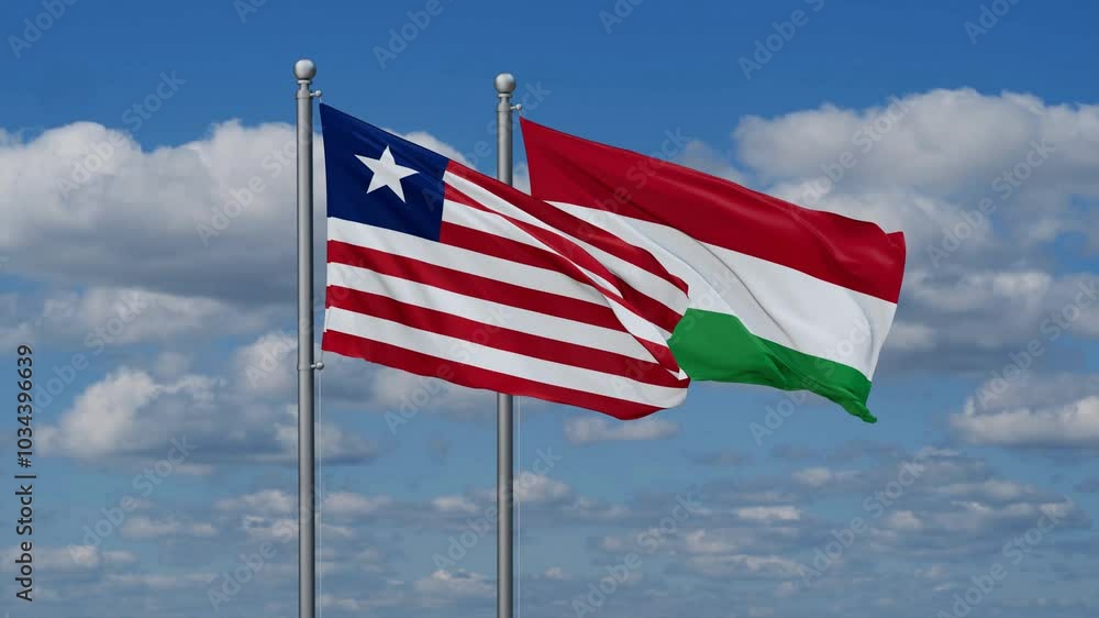 Hungary and Liberia flags flying together, video concept of the relationship, two country relations concept Hungary and Liberia flags flying together, video concept of the relationship, two country relations concept