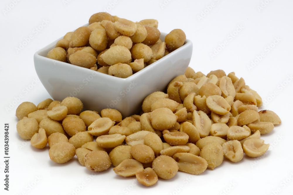 Salted peanuts heap on white Salted peanuts heap on white