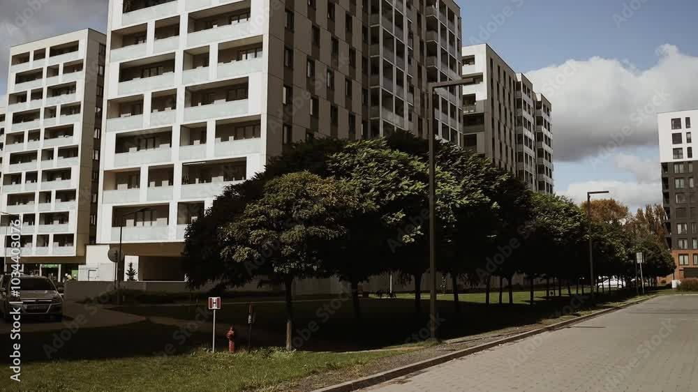 European residential architecture harmonizing with nature. Eco-friendly living in city with greens. Eco apartment building saving energy and fresh air concept. . High quality FullHD footage European residential architecture harmonizing with nature. Eco-friendly living in city with greens. Eco apartment building saving energy and fresh air concept. . High quality FullHD footage