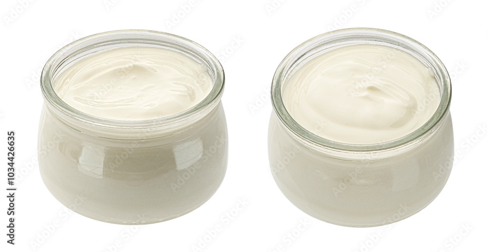 Glass jar of fresh homemade organic yogurt isolated on white background Glass jar of fresh homemade organic yogurt isolated on white background
