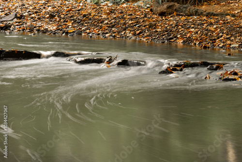 A long exposure photograph of Borsdane Brook, in Borsdane Woods, Wigan, Greater Manchester photo