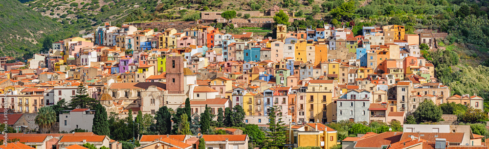 Colorful buildings of Bosa with the Castle of Serravalle. Oristano, Sardinia, Italy Colorful buildings of Bosa with the Castle of Serravalle. Oristano, Sardinia, Italy