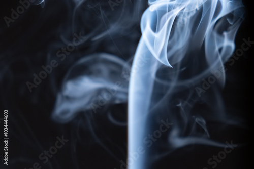 Captivating swirl of smoke on a dark background, showcasing ethereal patterns and textures in a moment of stillness photo